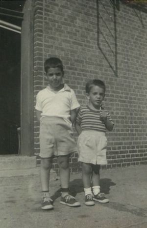Circa 1960, Bill and I standing outside of our apartment building in Brooklyn